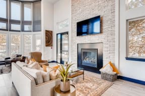 Clubroom living area with fireplace and TV