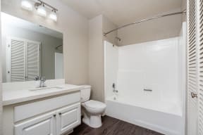 bathroom with walk in tub and shower