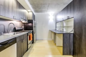 Kitchen with stainless steel appliances and storage space