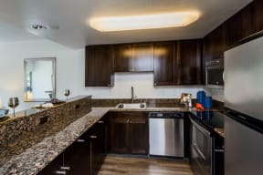 Palo Alto CA Apartments for Rent - Fully Equipped Kitchen with Stylish Interiors and Convenient Amenities such as Fridge, Stove, Microwave, and Dishwasher