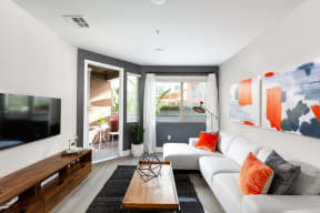 Apartments in Los Angeles for Rent - Wakaba LA - Living Room with Wood-Style Flooring and an Attached Private Patio