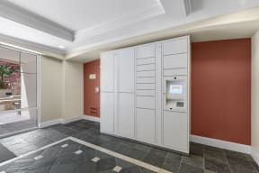a utility room with two white lockers and an automatic teller machine