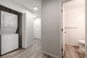 The Osprey Apartments Bathroom and Hallway with Washer and Dryer