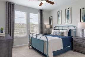 interior model home bedroom with large windows