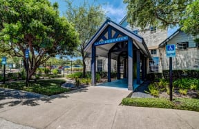 Entrance to Leasing Office with lush green landscape