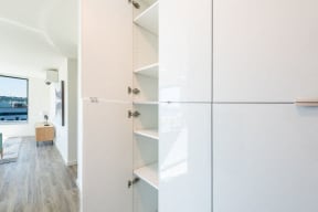 Storage Space With White Cabinetry at 10 Clay Apartments in Seattle, WA