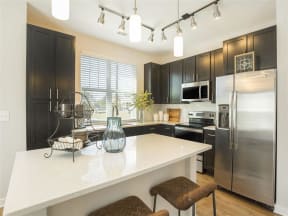 Granite Countertops In Kitchen at Pointe at Prosperity Village Apartment Homes in Charlotte