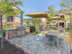 One White Oak Outdoor Living Area Including BBQs And Fire Pits in Cumming, Georgia Apartment Rentals