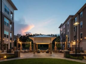 Outdoor Pointe at Lake CrabTree courtyard with fire pit in Morrisville Apartments