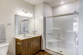 Bathroom with glass stand in shower tub combo