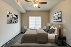 Bedroom with ceiling fan and queen sized bed
