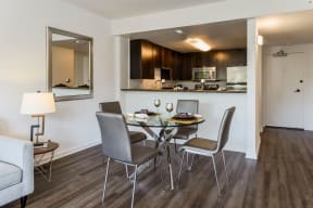 Apartments for Rent Palo Alto CA - Palo Alto Place - Dining Room with Wood Flooring, White Walls, and Kitchen