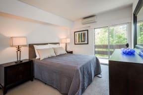 Luxury Apartments in Palo Alto CA - Palo Alto Place - Bedroom with Carpeting, Sliding Glass Doors, and White Walls
