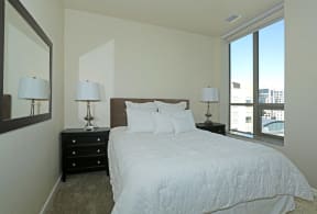 Pet-Friendly Apartments in Sacramento, CA - Bright and Spacious Bedroom with Plush Carpet and Modern Furnishings