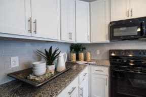 Kitchen With White Cabinetry And Appliances at Meridian at Fairfield Park, North Carolina, 28412