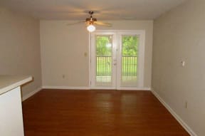 living room with double doors leading to deck