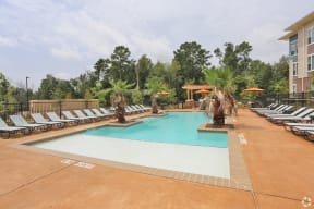 Pool with Tanning Shelf Apartments located in Conroe