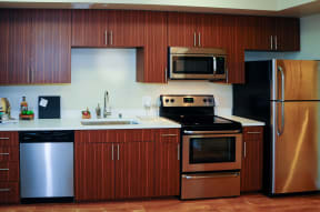 Apartments for Rent in San Jose, CA - Centerra Kitchen with stainless steel appliances and modern wood cabinets