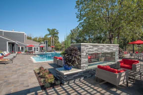 pool fireplace with seating Apartments in Pittsburg, CA l Kirker Creek Apartments