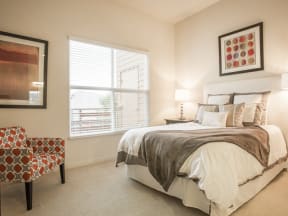 Furnished bedroom with window Apartments in San Mateo, CA - Mode Apartments Bedroom