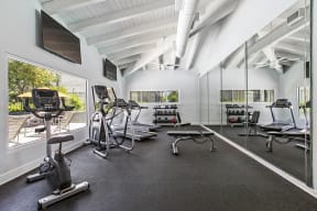Garden Grove, CA Apartments for Rent - Park Grove Fitness Center with exercise bike, an elliptical, and treadmills