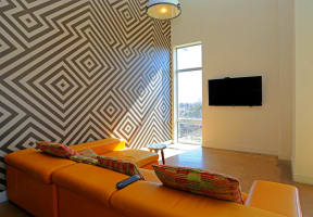 Living Room With TV at 1221 Broadway Lofts, San Antonio