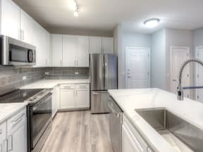 Eat-In Kitchen Table With Sink at The MilTon Luxury Apartments, Vernon Hills, IL, 60061
