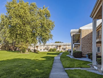 Exterior of miller west apartment with lots of green space