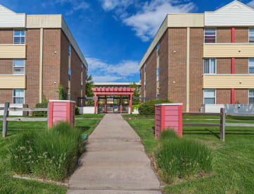 Exterior of Denver apartment building with grassy lawn