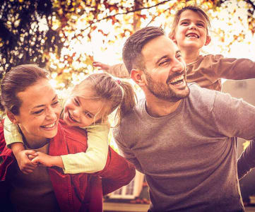 Happy Family in Autumn at Brookwood at Islip, New York, 11751