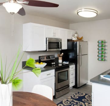 Kitchen and dining area| Stoneridge Luxury Apartments in Walnut Creek, CA