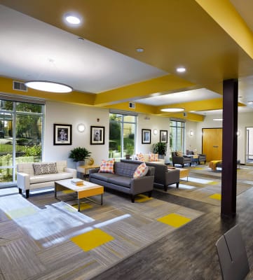 Community room with seating areas, Cornerstone Village Pittsburgh, PA