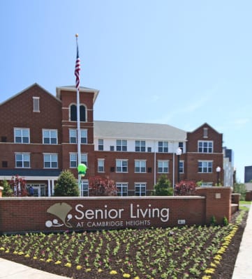 exterior of front apartment building and property sign-Senior Living at Cambridge Heights Apartments, St. Louis, MO
