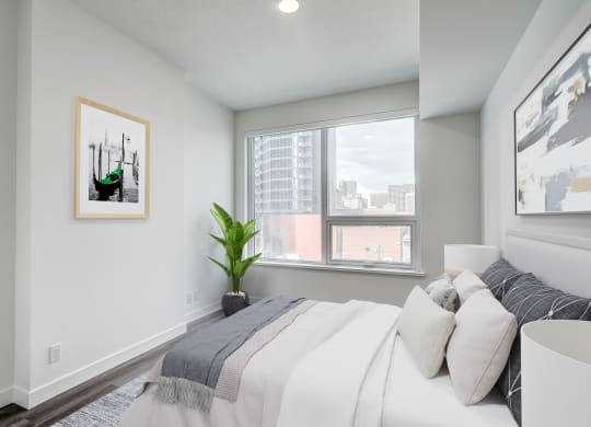 Comfortable Bedroom With Large Window at BLVD Beltline, Calgary, AB, T2G 2K4