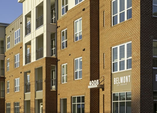 Exterior of four-story building with retail space available on the first floor