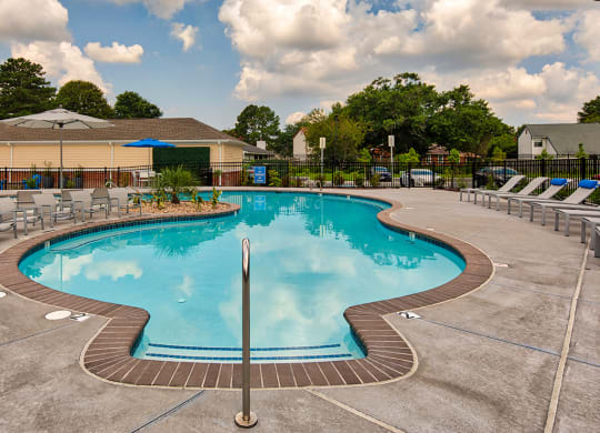 Pool and chairs at The Choices at Holland Windsor Apartments