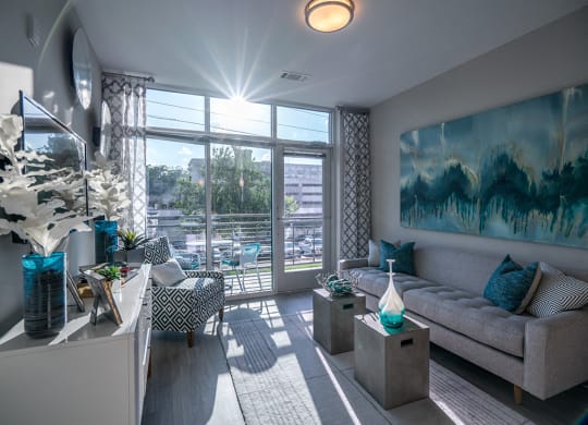 Living Room With Expansive Window at Link Apartments® Glenwood South, North Carolina, 27603