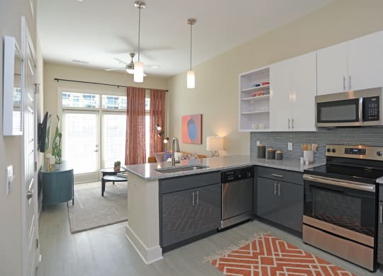 Electric Range In Kitchen at Link Apartments® Innovation Quarter, Winston Salem, North Carolina