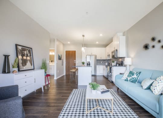 Open floor plan with hardwood floors and white cabinetry at Ascend at Woodbury MN 55129 new luxury apartments