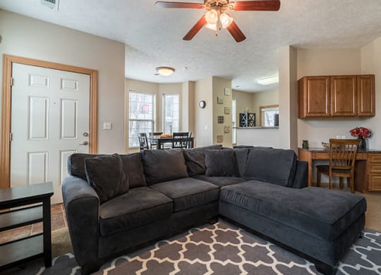 Living room that easily fits an over-sized couch at Stone Creek Villas Apartments in Omaha Nebraska