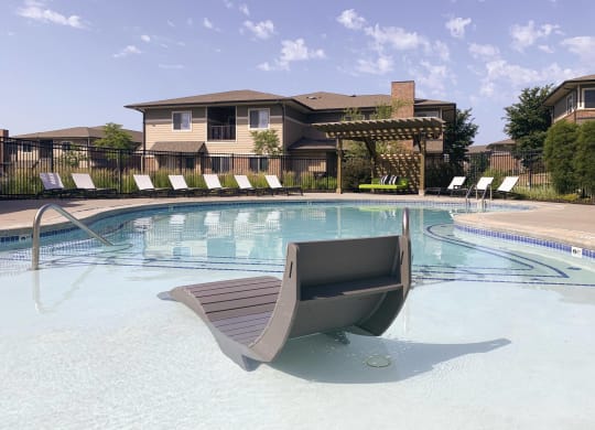 Resort style swimming pool with sun tanning loungers at North Pointe  Villas Lincoln Nebraska