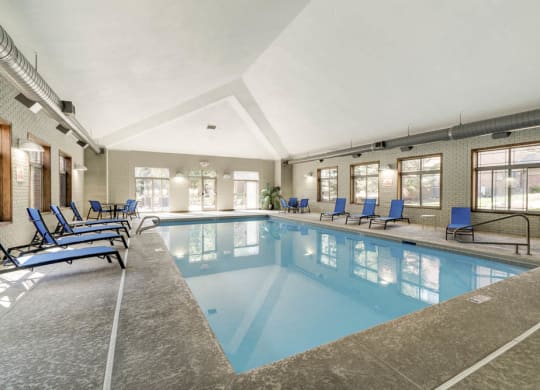 Indoor swimming pool with lounge chairs at Southwind Villas in southwest Omaha in La Vista, NE, 68128