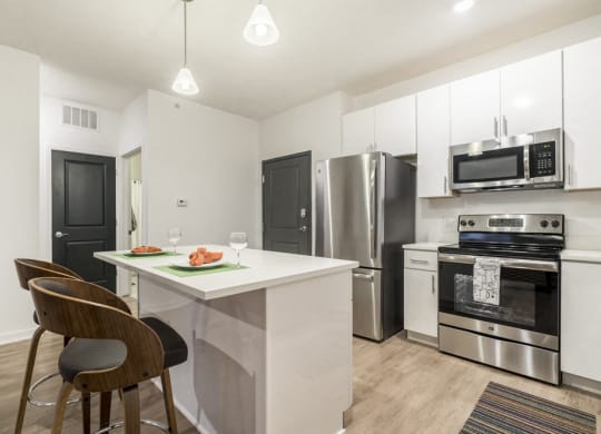 1 bedroom apartment with white cabinets and stainless steel appliances near UNMC in Omaha's Blackstone District