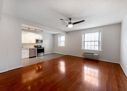 Gorgeous Hardwood Floor in Living Room Leading to Kitchen at Connecticut Plaza Apartments, 2901 Connecticut Ave NW, Washington, DC, 20008.