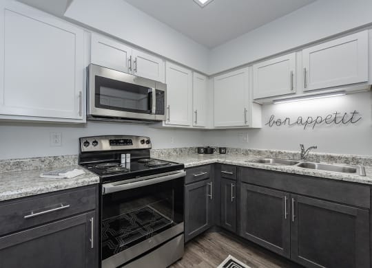 Kitchen appliances and cabinets at Bloomfield Apartments, Dayton