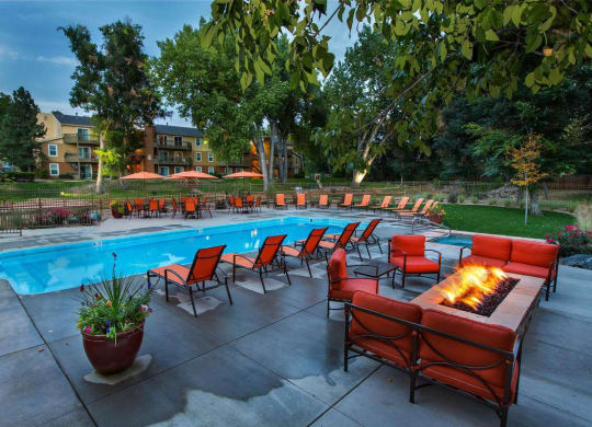 Poolside Lounge Area With Firepit at Woodland Hills Apartments, Colorado Springs