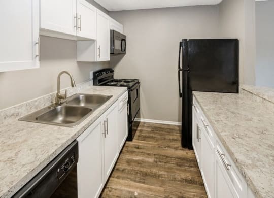 Kitchen with wood flooring and new applicances
