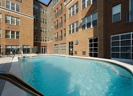 Pool with apartments in the background