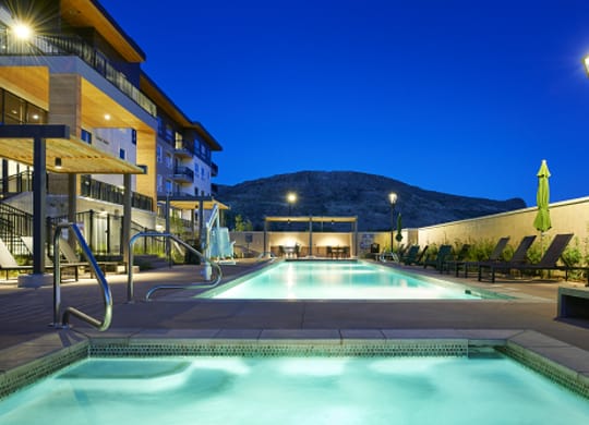 pool area during nighttime at epoque golden apartments