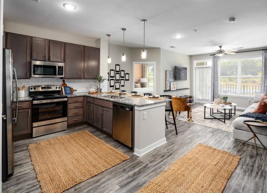 Kitchen With Living Area at Abberly Liberty Crossing Apartment Homes, Charlotte